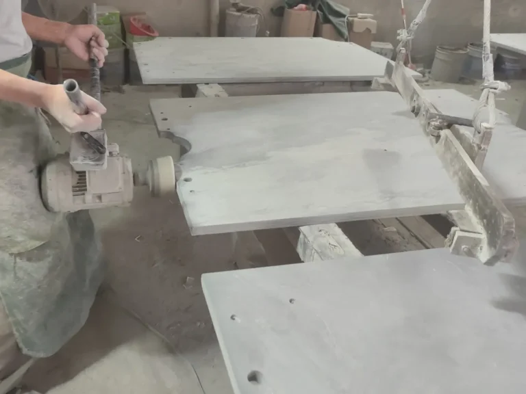 skilled technician performing final hand finishing on snooker slate