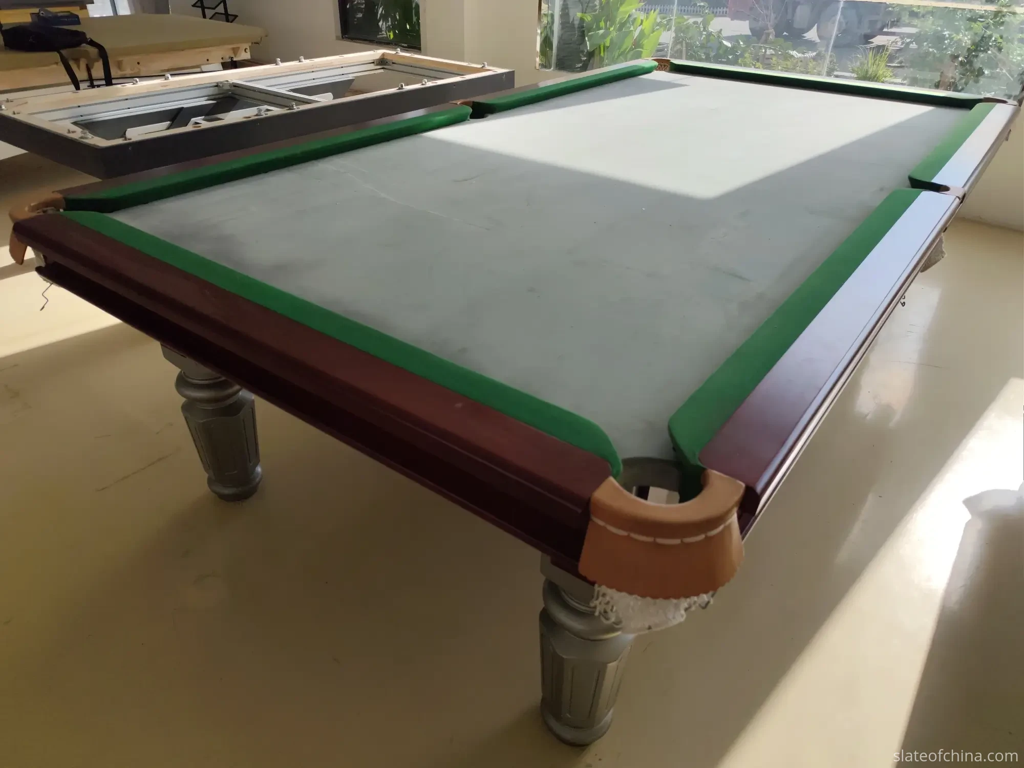 Pool vs Snooker vs Chinese 8-Ball Slate Thickness: 25mm, 45mm and 50mm 2 Three-piece 25 mm pool table slate set laid out on a factory floor showing thin machined edges