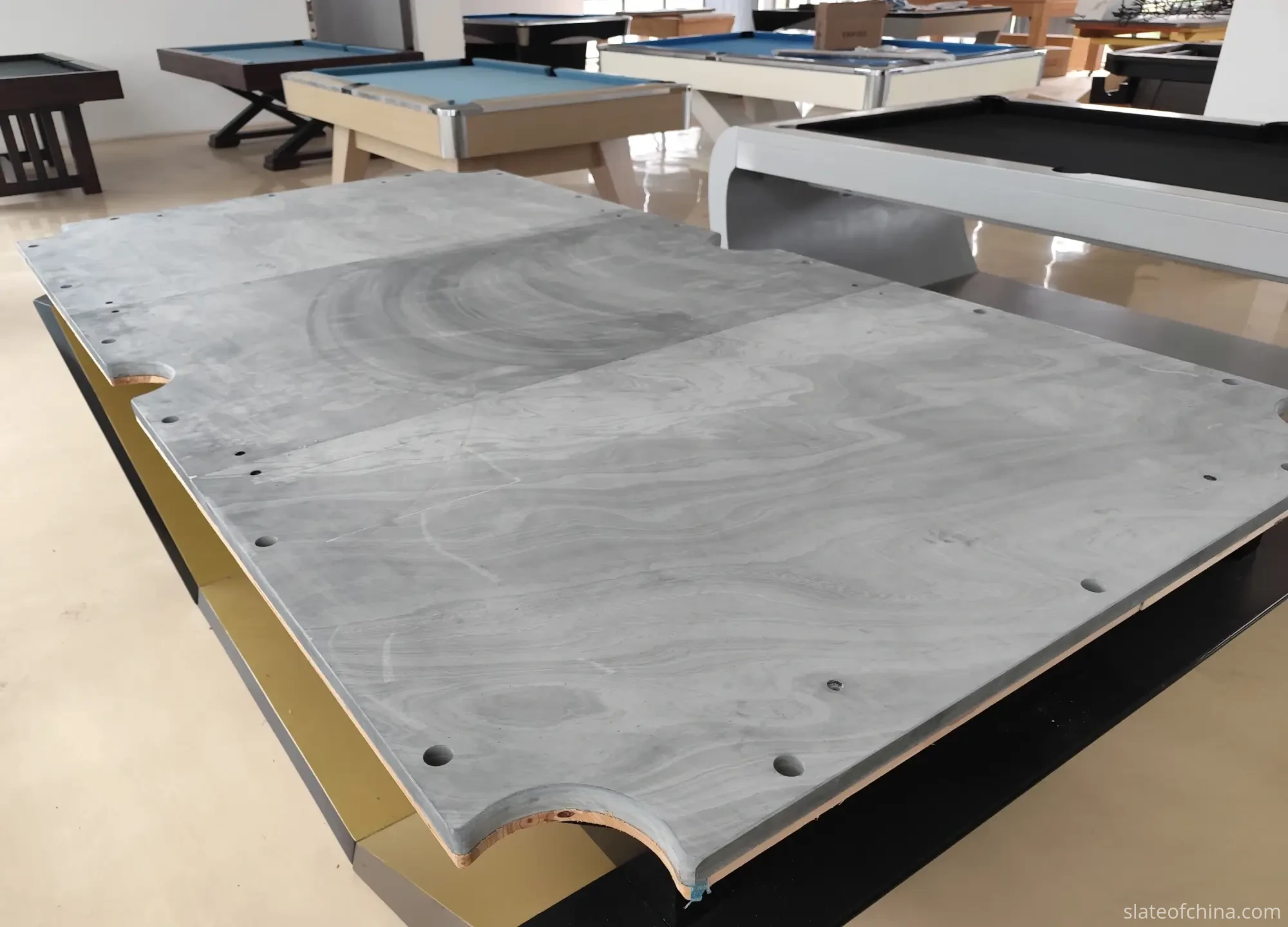 American Pool Table Slate Buying Guide for Manufacturers 1 Three-piece American pool table slate set laid out on factory floor showing three matched dark grey panels