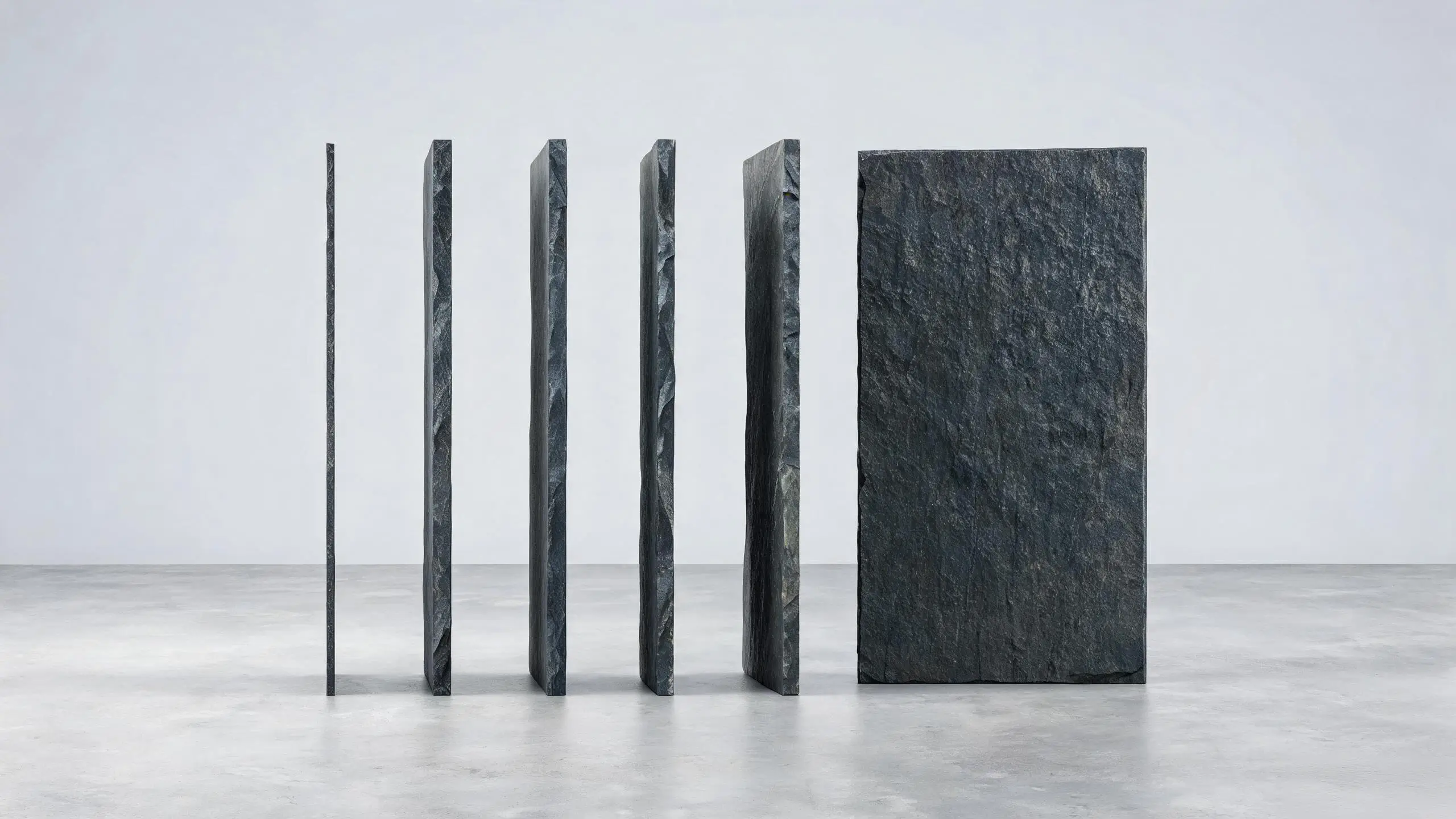 Billiard Slate Technical Specifications 2 Billiard slate panels standing on edge showing thickness range from 19 mm to 50 mm