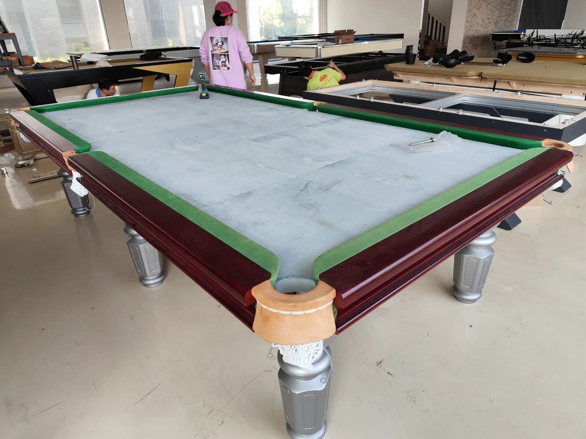 Overhead view of five slate panels laid side by side forming one large rectangular bed with four fine seam lines
