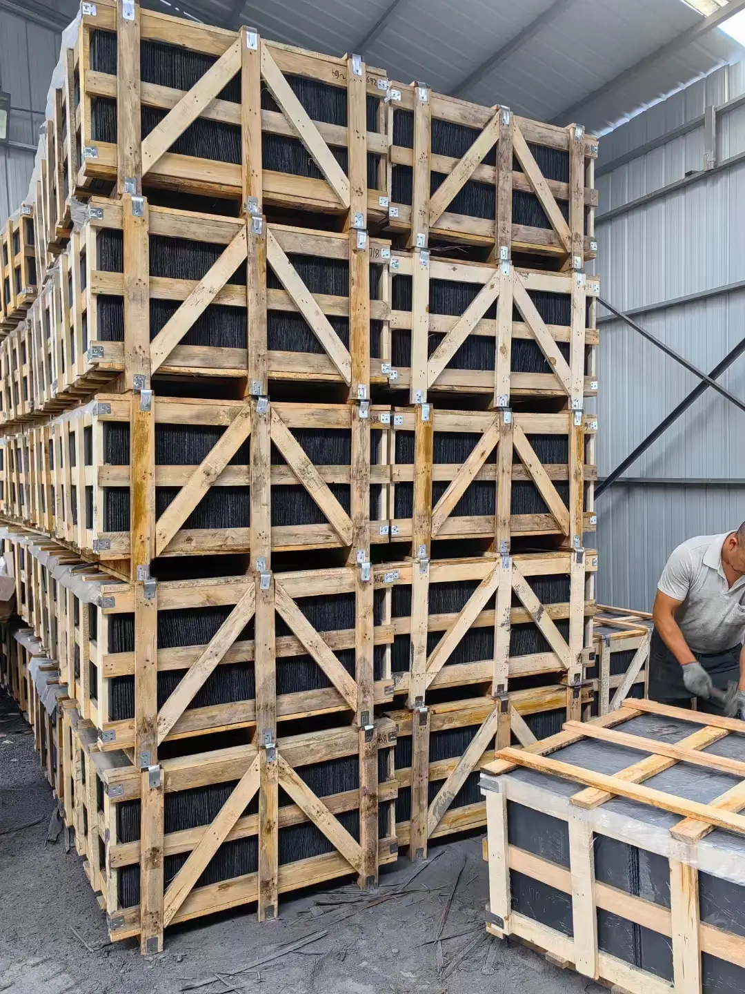 Wooden export crates packed with slate stacked in a factory yard