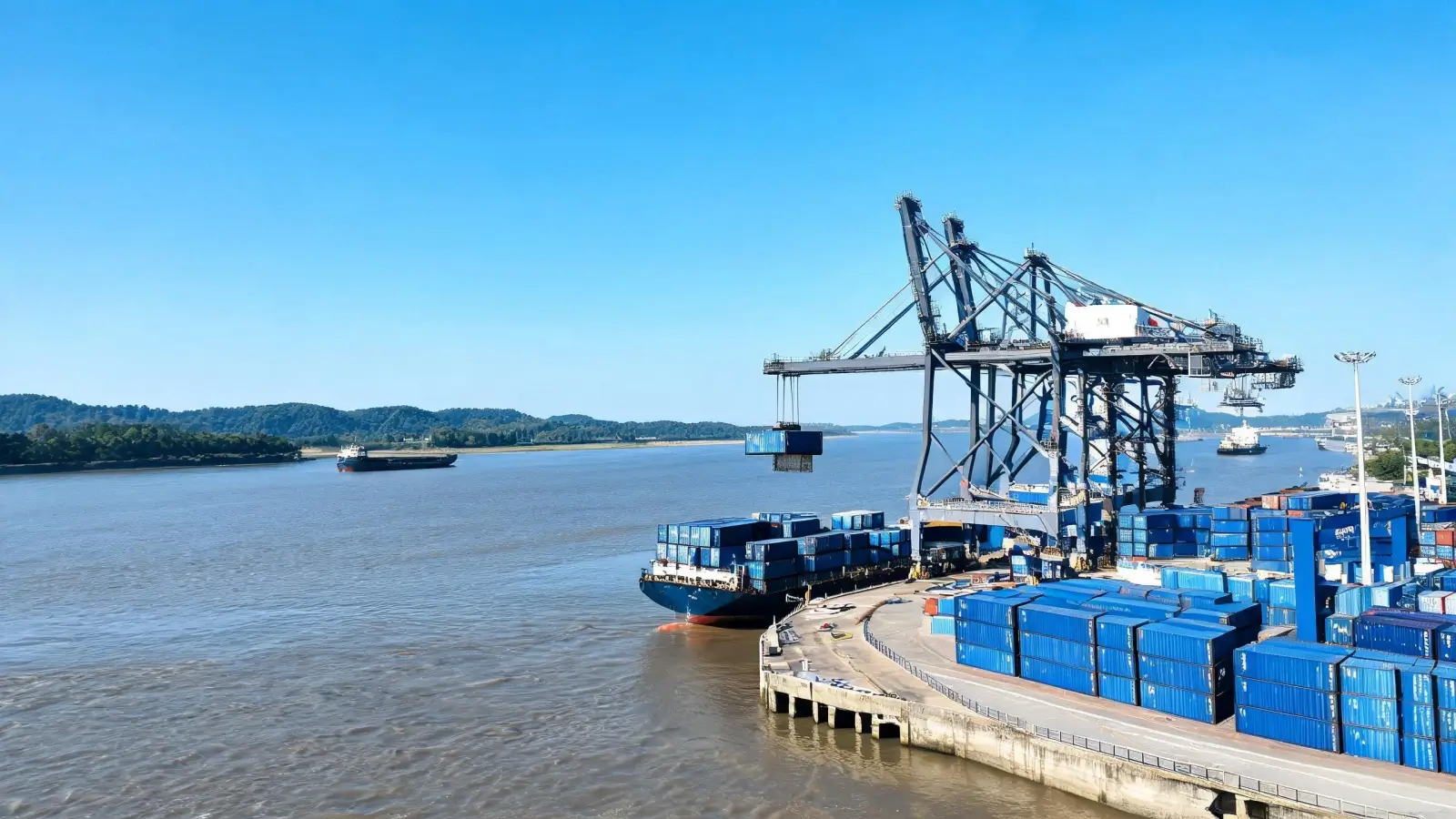 Container ships and gantry cranes at Jiujiang Port on the Yangtze River, where Jiujiang slate export containers begin their journey