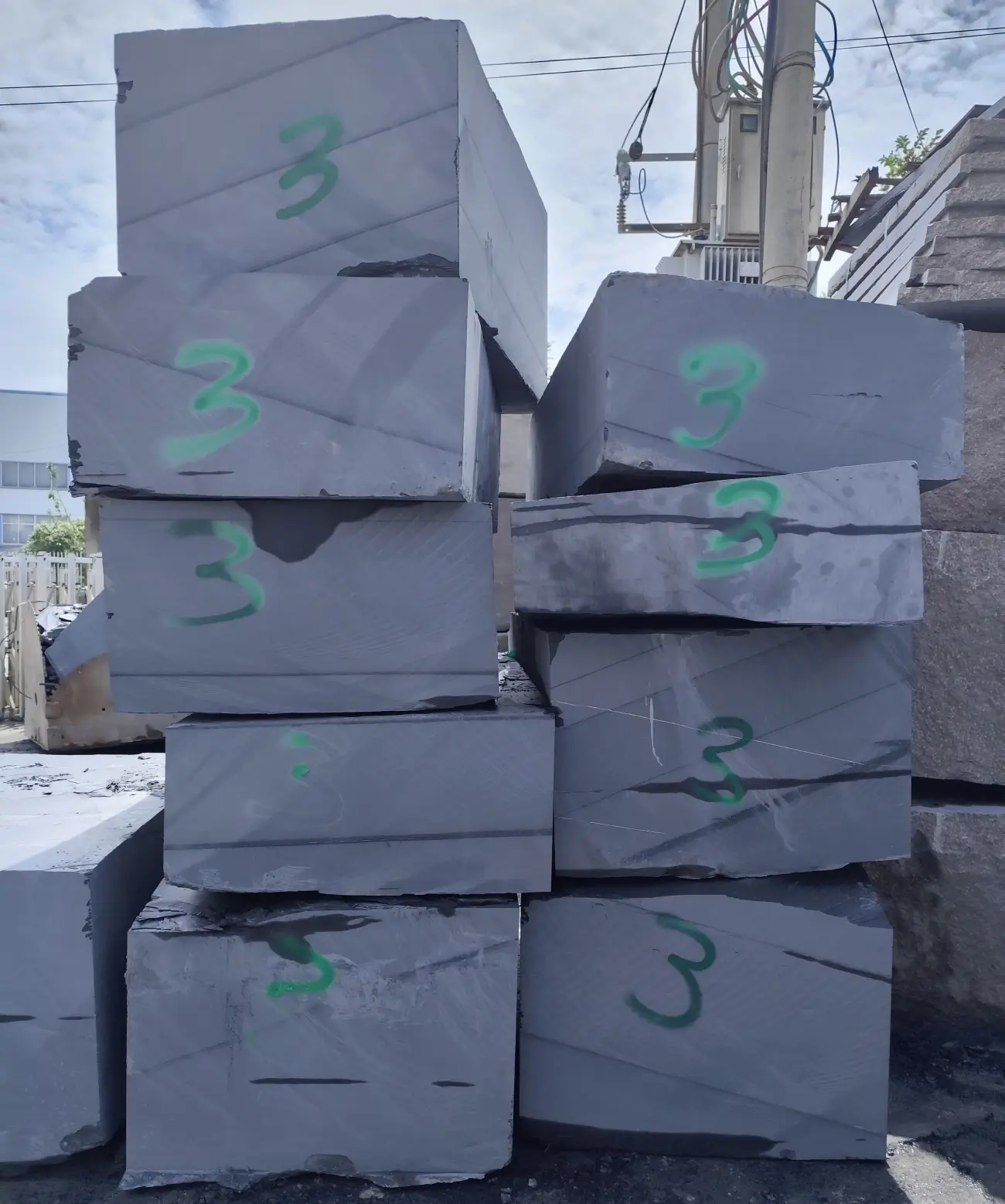 How to Verify a Jiujiang Slate Supplier 1 Raw slate quarry blocks stacked in a stockyard in Jiujiang, China