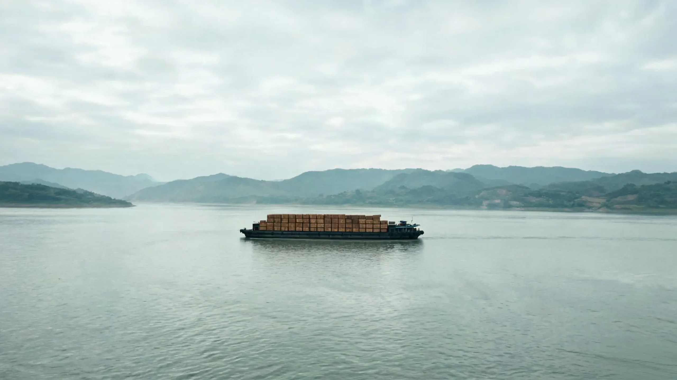 Cargo barge on the Yangtze River near Jiujiang showing the logistics advantage of riverside slate production