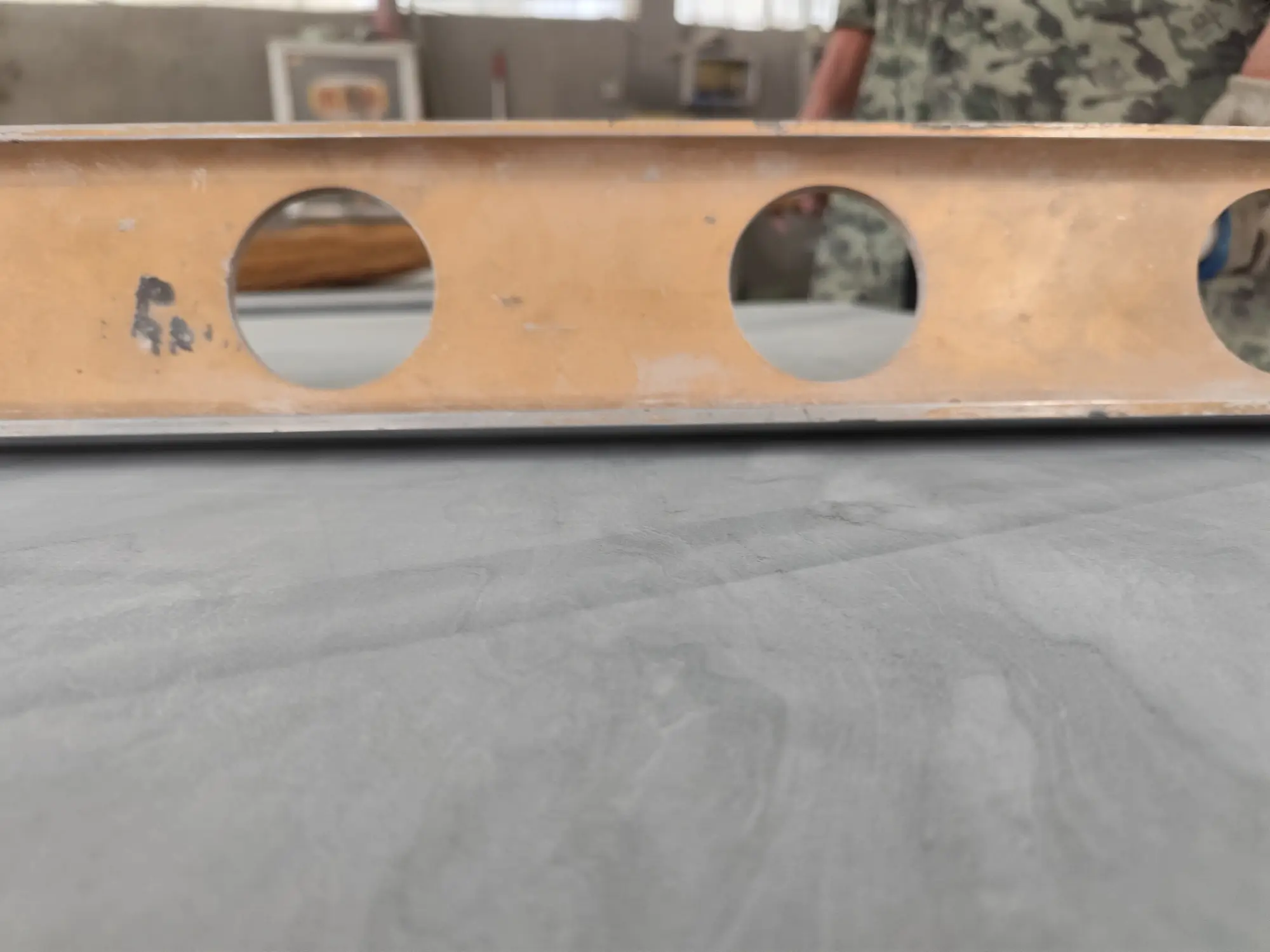 Inspection light sweeping a ground billiard slate surface