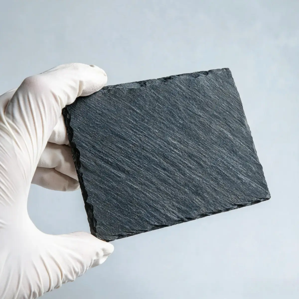 Close-up of natural Jiujiang slate showing dark grey fine-grained texture and clean natural cleavage surface