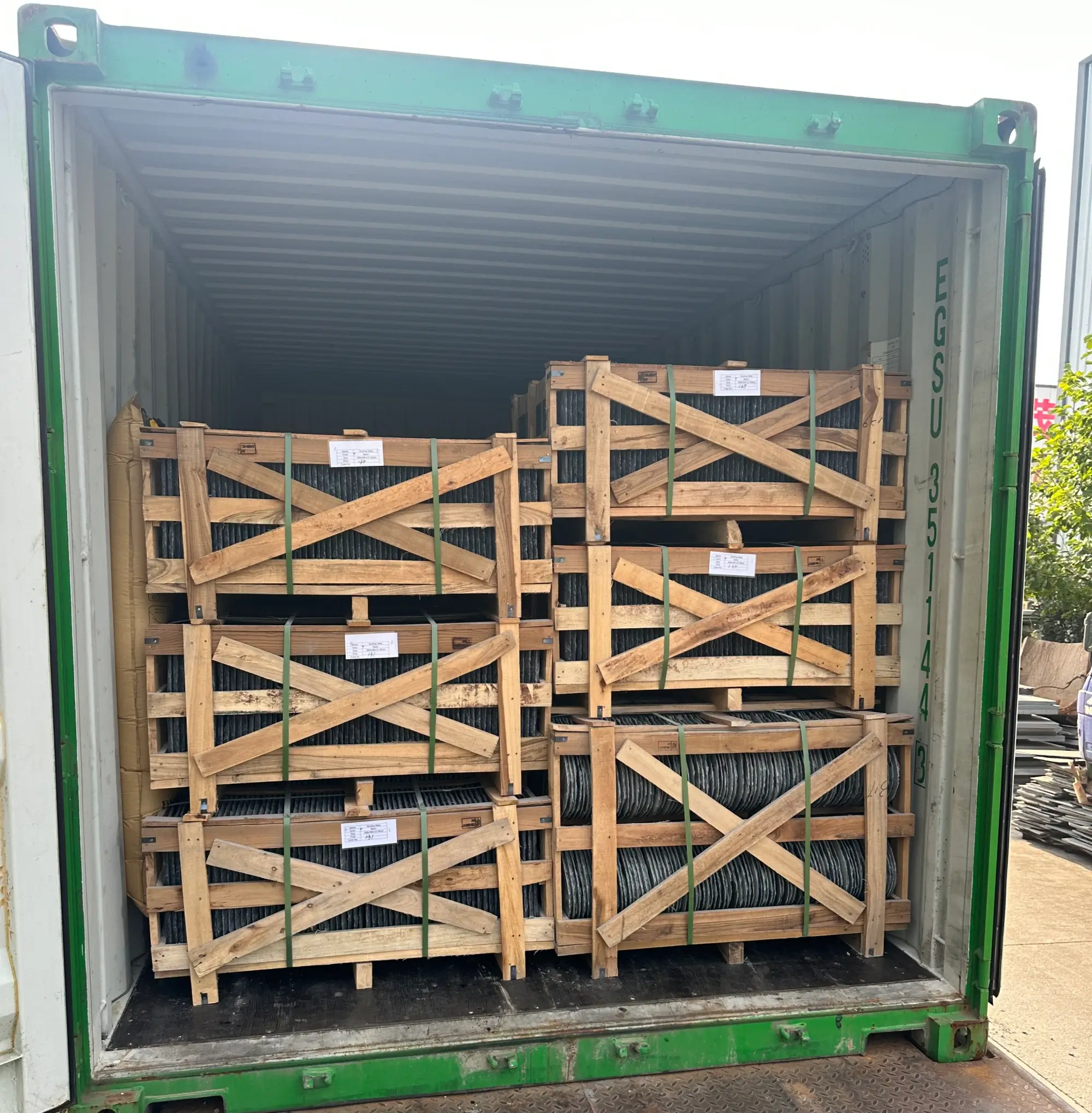 Why Roofing Buyers Choose Jiujiang Slate 4 Shipping container loaded with wooden crates of roofing slate at a factory yard