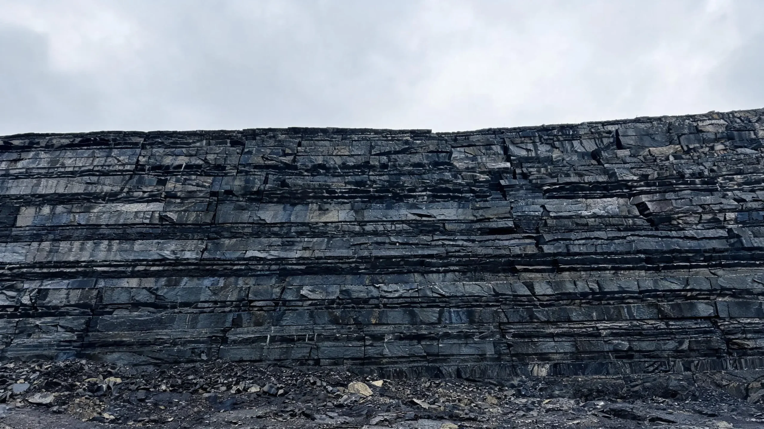 Slate quarry face showing natural geological layering and cleavage planes