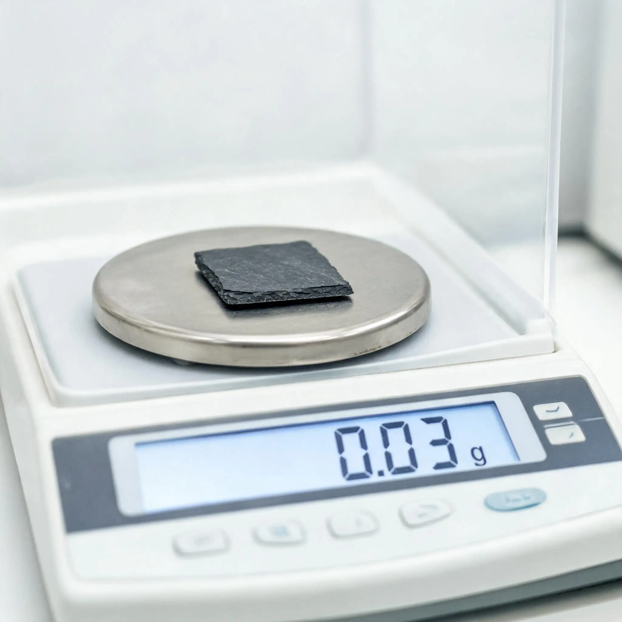 Slate Water Absorption Test in Laboratory Laboratory precision balance with a slate tile sample for water absorption testing