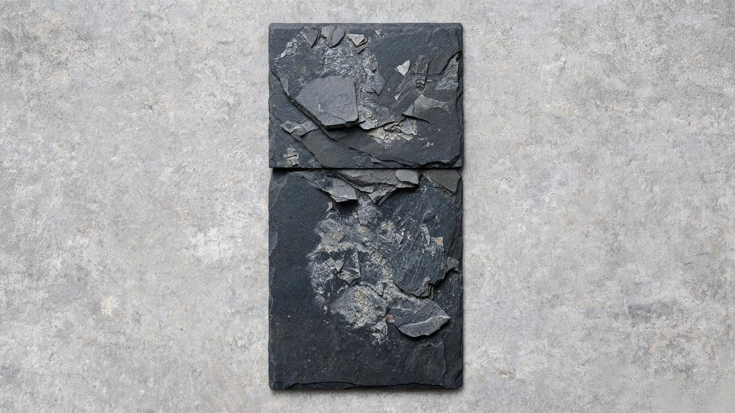 Slate tile delamination — layers separating and flaking Slate tile showing surface delamination and spalling damage