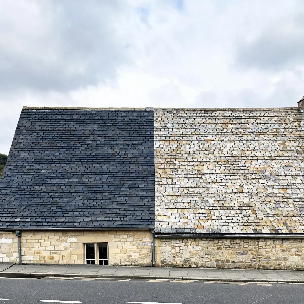 Comparison of newly installed slate roof and same slate after decades of natural weathering