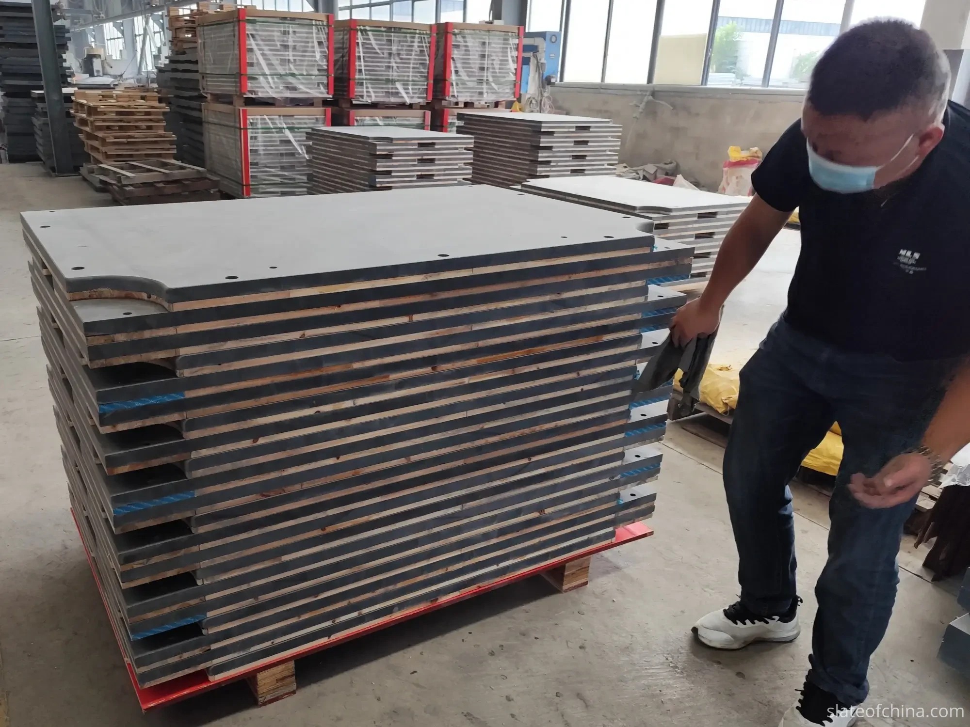 Common Billiard Slate Defects 6 Billiard slate panels arranged on a factory floor for inspection