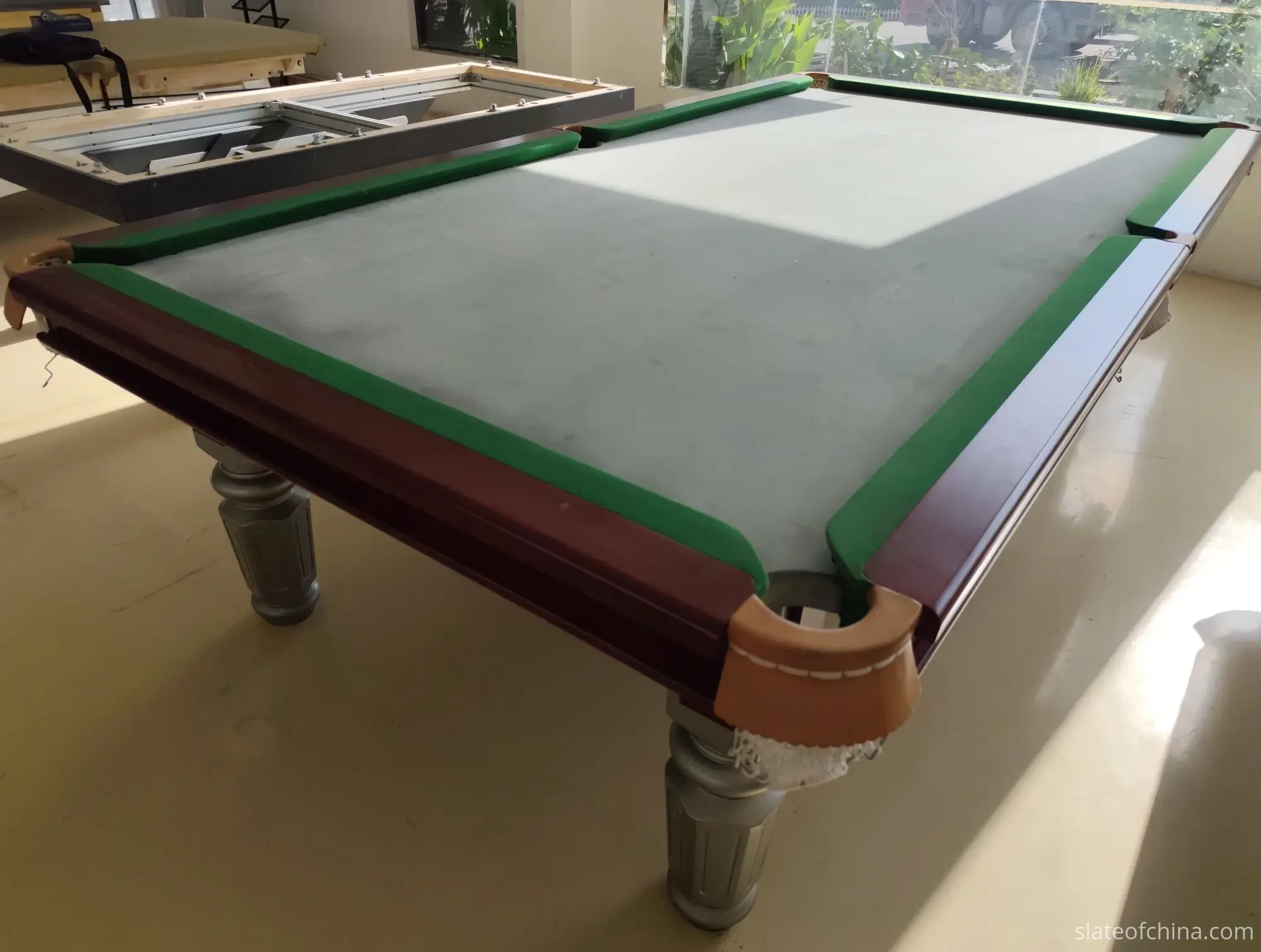 Surface Quality Inspection 4 Bare three-piece billiard slate bed mounted on an assembled pool table before cloth installation