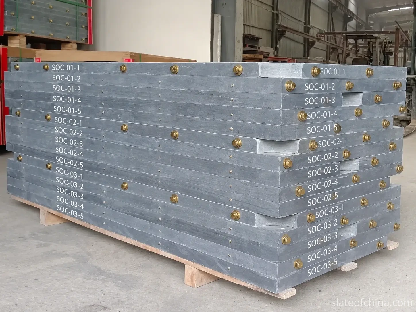 Billiard Slate Quality Control: What Buyers Should Check 2 Stacked billiard slate panels with painted set identification codes (SOC set and piece numbers) on the machined edges