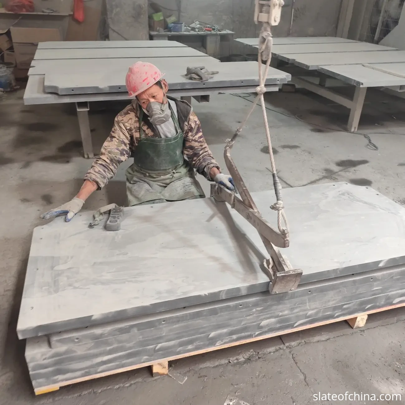 Custom Billiard Slate Manufacturing 2 Wide view of a natural slate manufacturing workshop with panels of various sizes on work tables