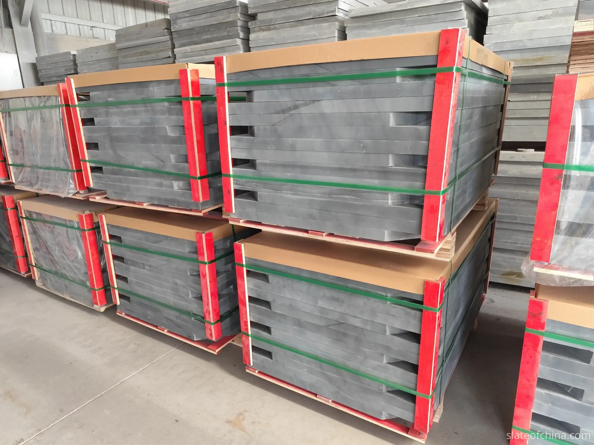 Finished slate panels stored by thickness Finished billiard slate panels sorted and stored by thickness specification in a factory warehouse