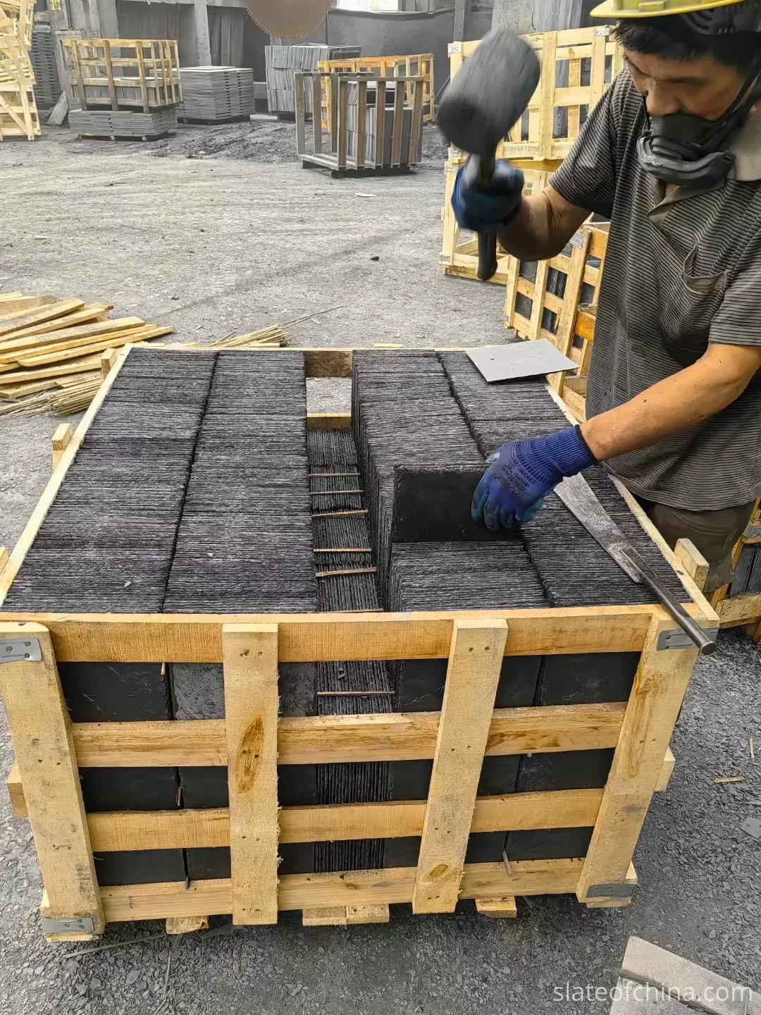 Jiujiang Slate Buyer Checklist 3 Roofing slate stacked in layers inside an open wooden export crate with lath separators and strapping
