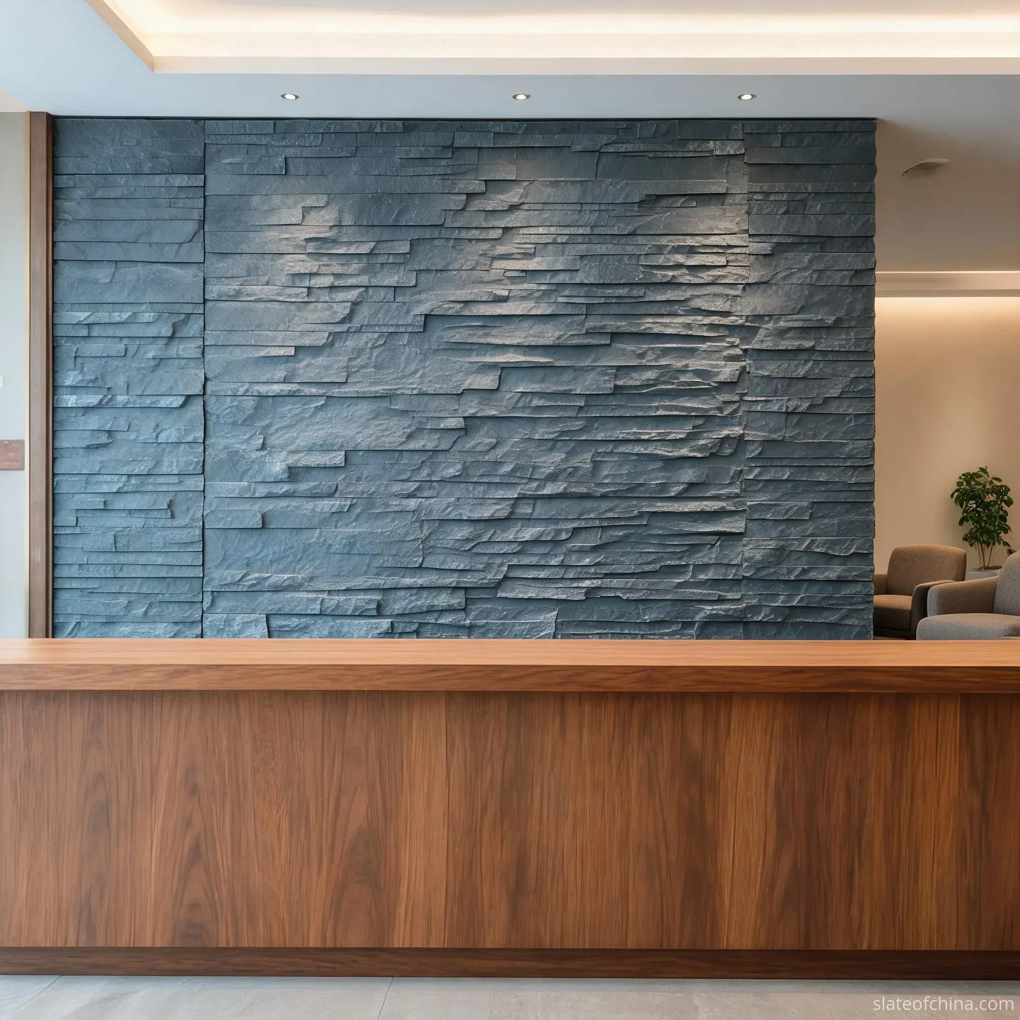Exterior vs Interior Slate Cladding 1 Hotel reception feature wall in natural cleft blue-grey slate with low layered relief catching soft shadow