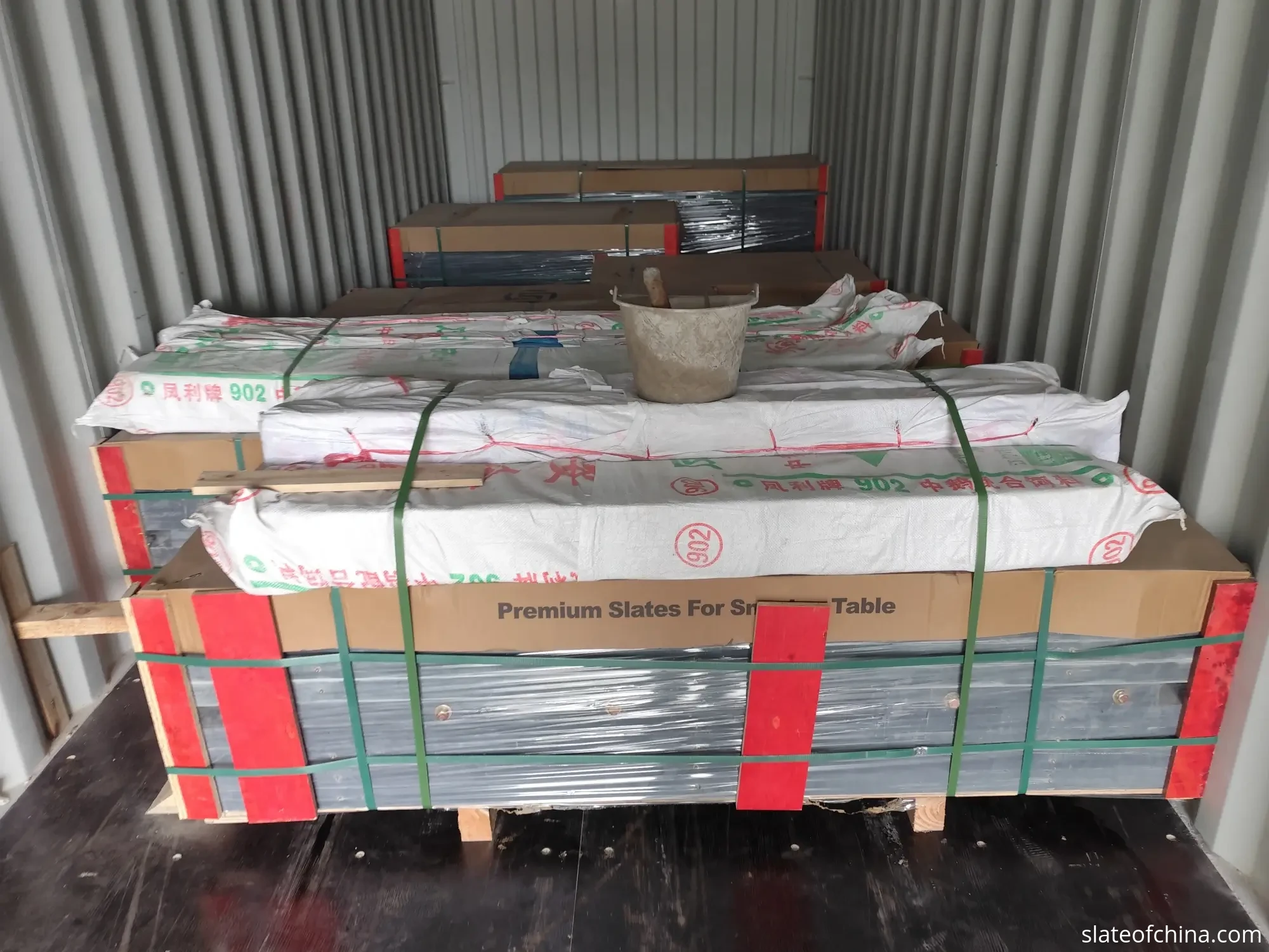 Glossary of Billiard Slate Terms 6 Pallet-wrapped and steel-banded billiard slate sets ready for export at a loading bay