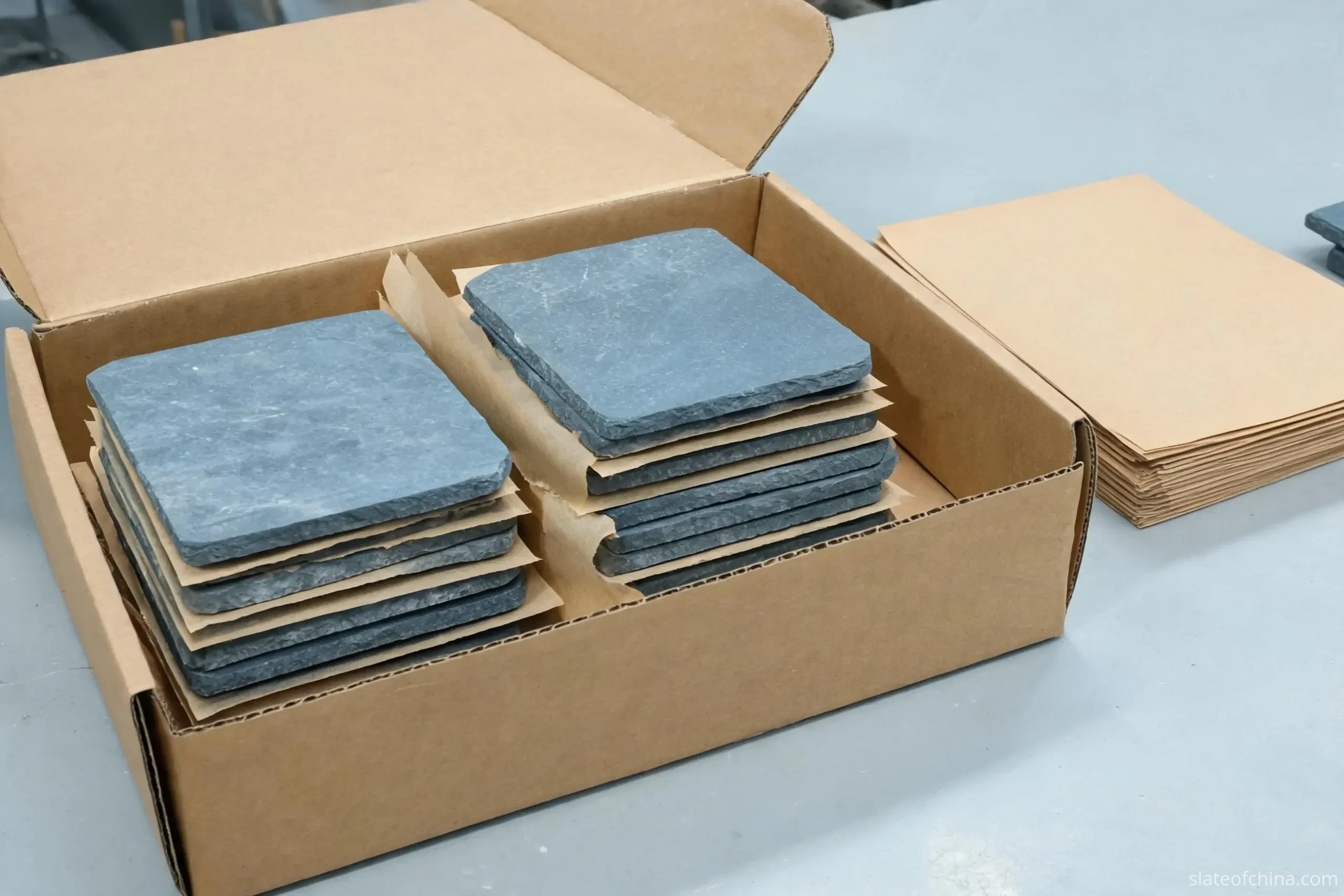 Wholesale Slate Crafts from China 2 Blank slate coasters packed in bulk into a kraft inner carton with paper interleaves between layers of stone