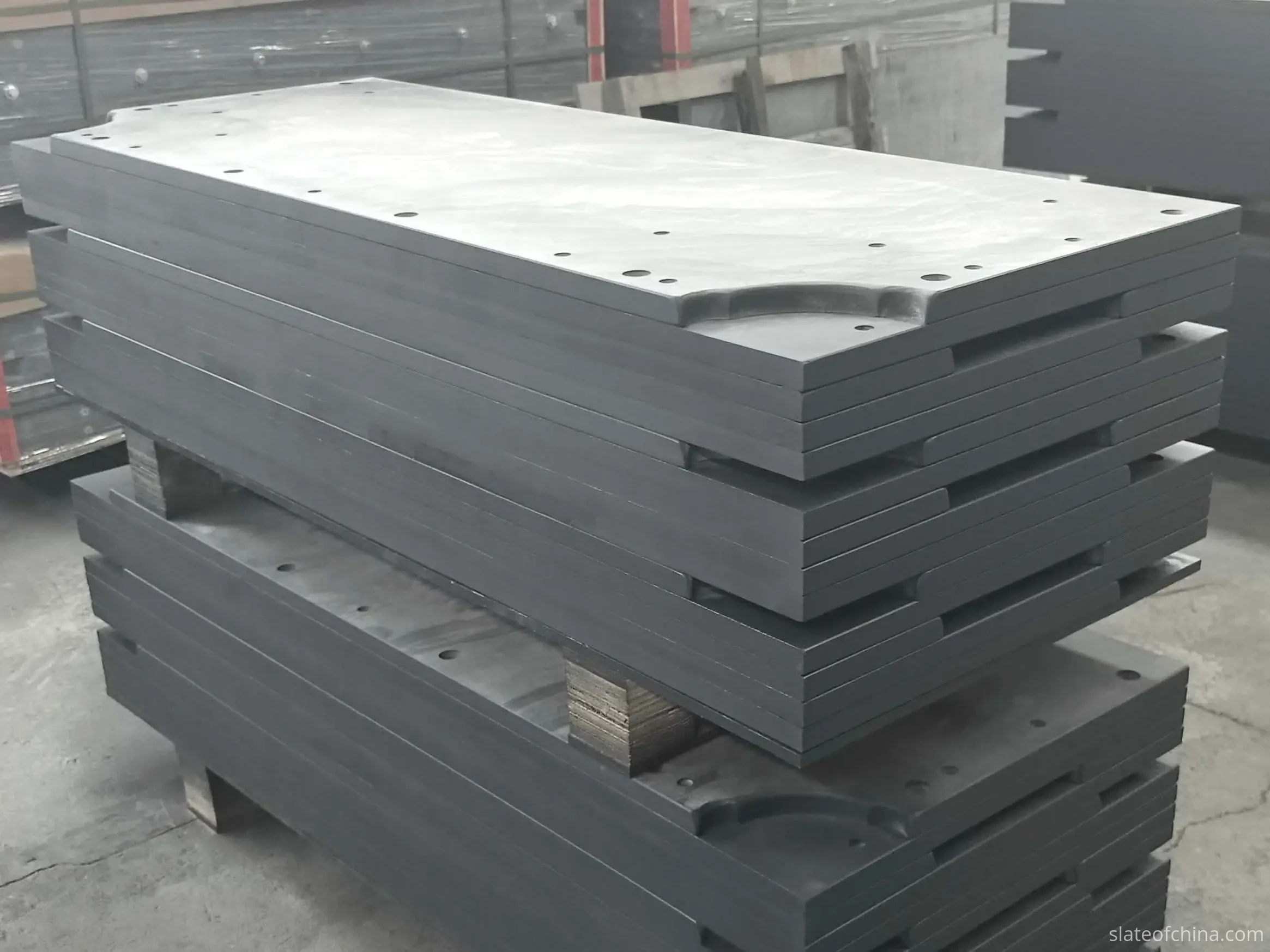 Slate Panel Thickness — Solid Machined Edges Stacked billiard slate panels showing solid stone edges and full panel thickness in profile