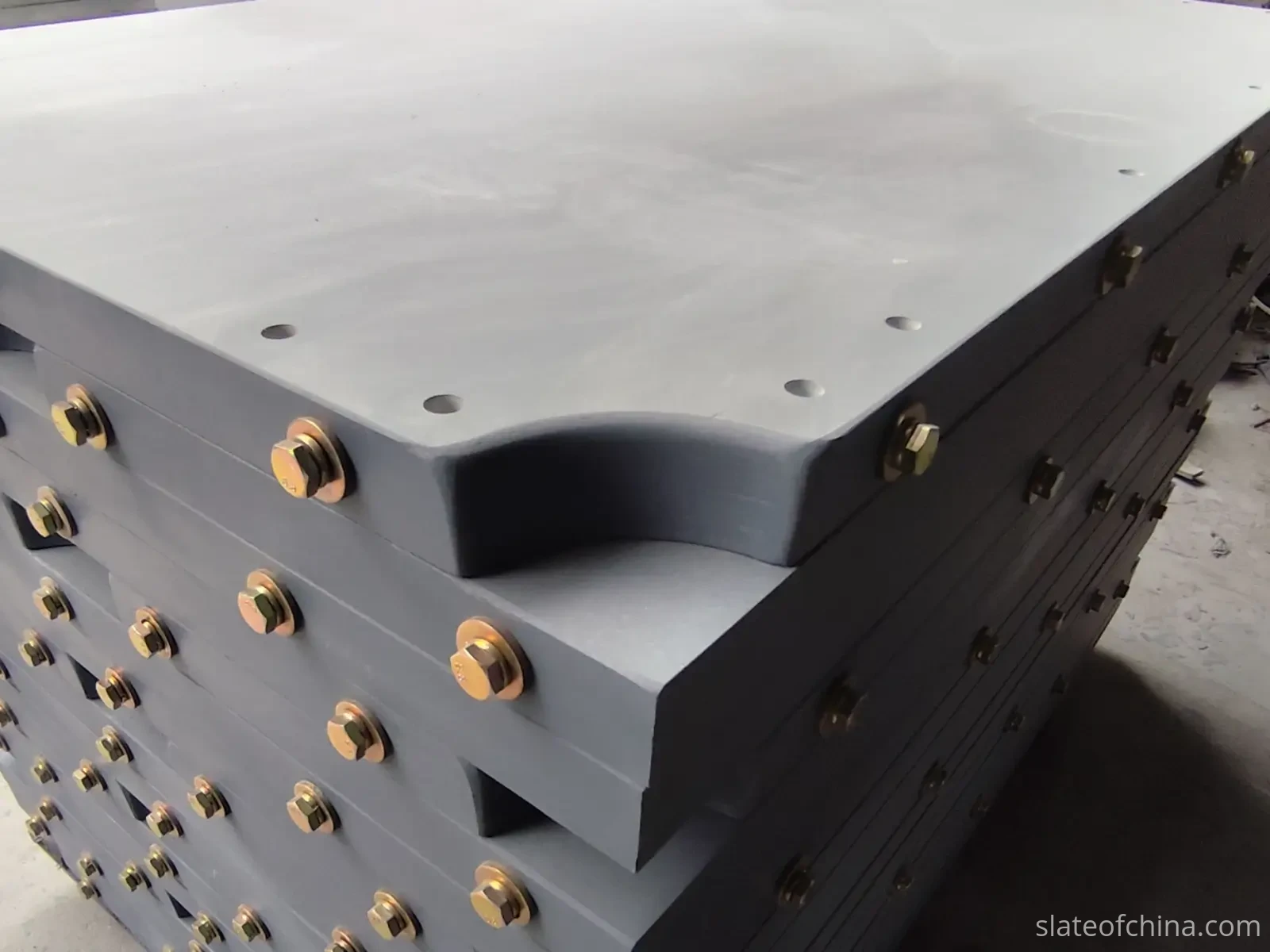 Slate pocket opening radius detail Stacked slate panels showing aligned concave corner radius cutouts