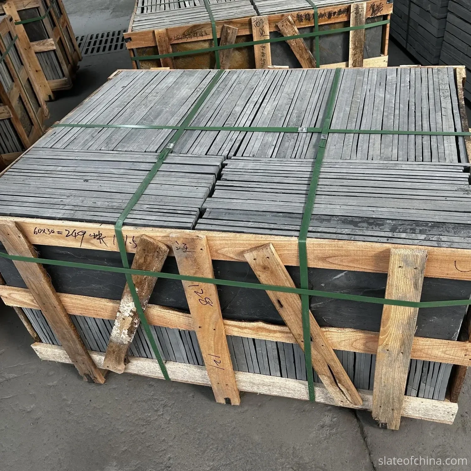 Slate Quarries and Processing in Jiujiang 4 Roofing slate tiles stacked flat inside strapped timber export crates, hand-tallied and waiting for loading