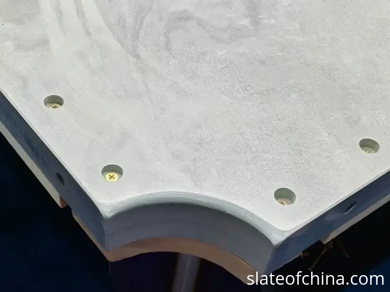 How to Choose Billiard Slate 3 Close-up of a 45 mm billiard slate corner showing the thick ground edge, countersunk mounting holes and screws
