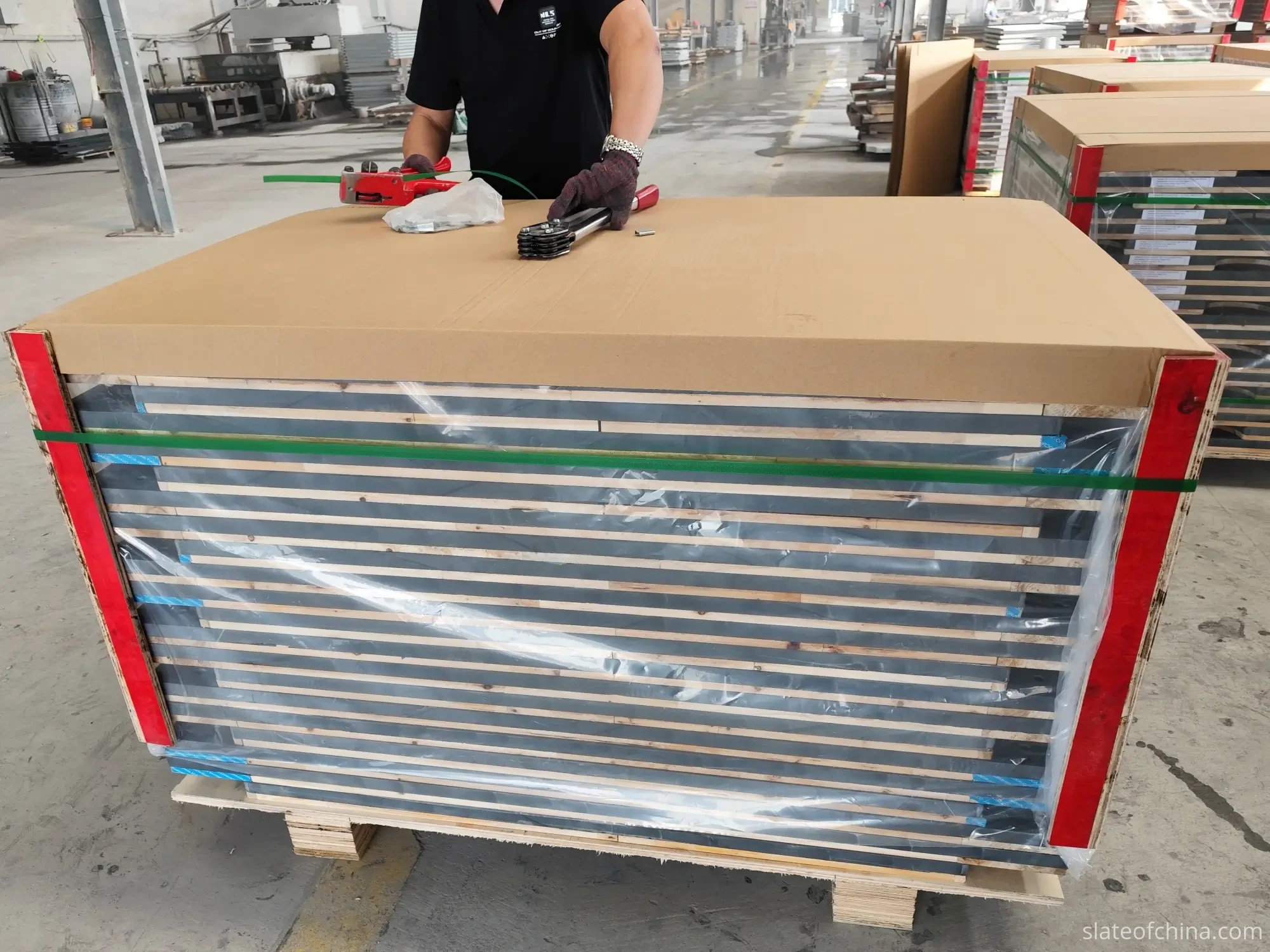 Slate Joint Alignment 6 Stacked billiard slate panels packed on a wooden pallet with spacers, corner protectors, shrink film and strapping for export